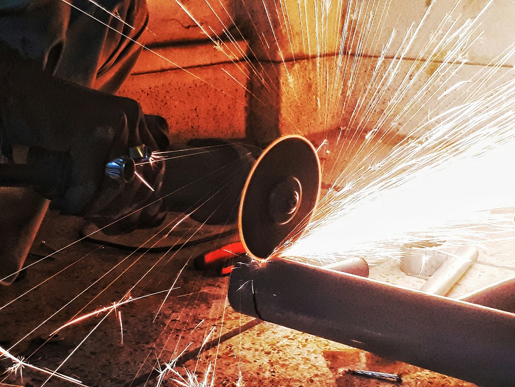 Close up of angle grinder in the mining industry with sparks