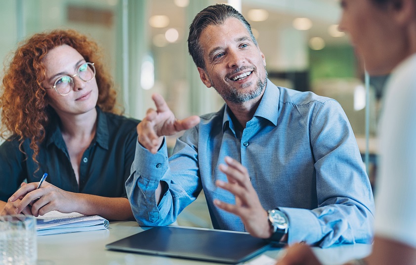 Woman and man in small business training with female facilitator