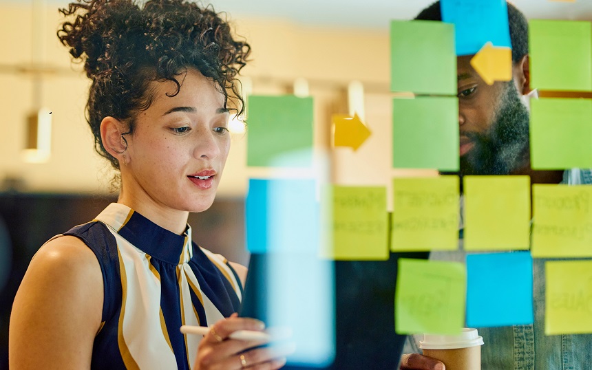 Man and woman working on business plan