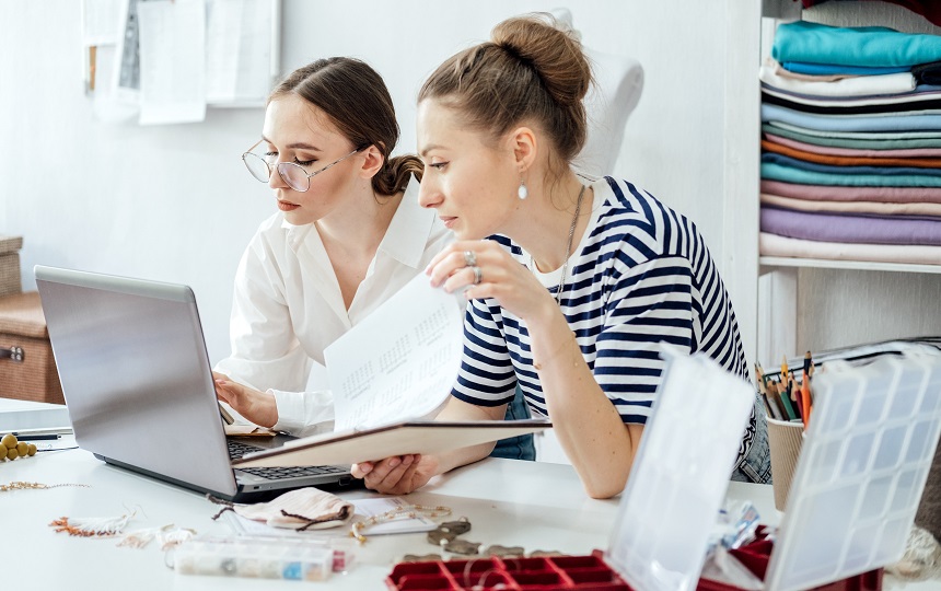 Two women reviewing business strategies